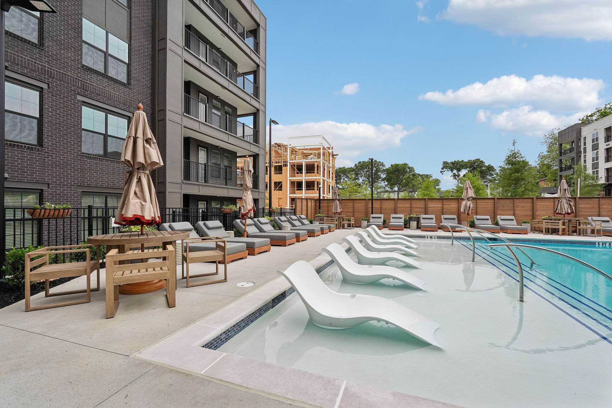 apartment pool with lawn chairs apartment pool with lawn chairs