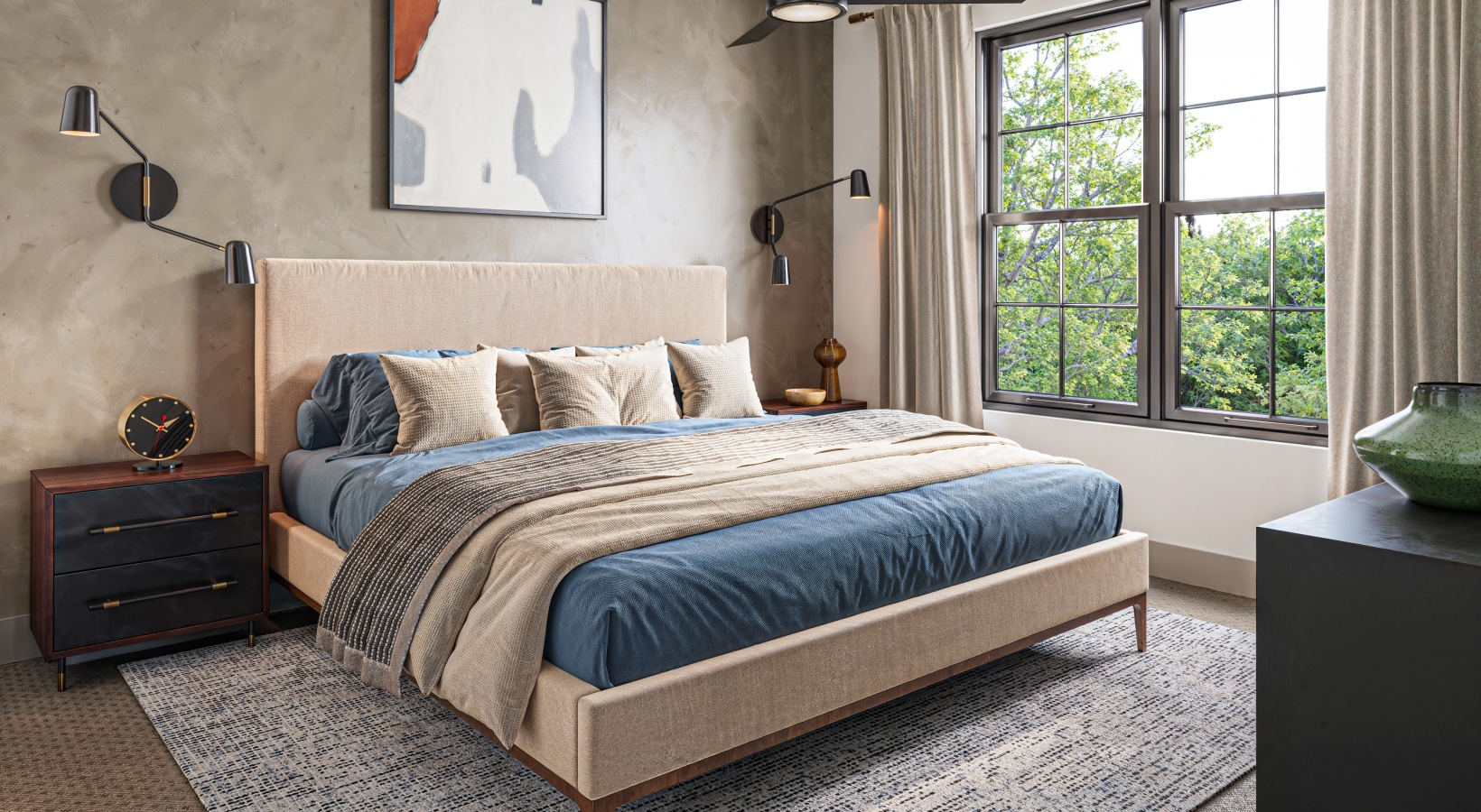 Bedroom with queen sized bed, rug, carpet, and large window Bedroom with queen sized bed, rug, carpet, and large window